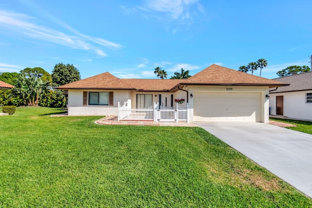 ranch-style house featuring concrete driveway, stucco siding, roof with shingles, an attached garage, and a front yard