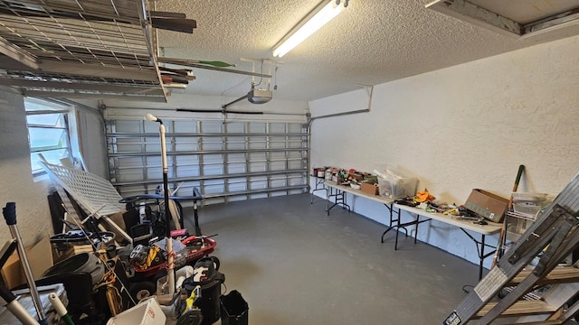 10298 Greentrail Dr N, Boynton Beach, FL 33436 - garage featuring a textured wall and a garage door opener