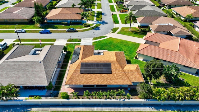 birds eye view of property with a residential view