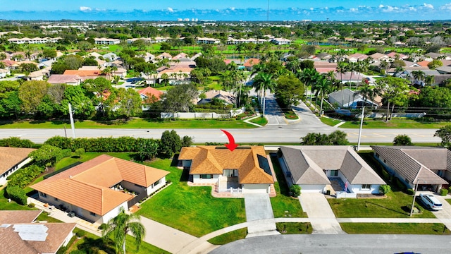 birds eye view of property with a residential view