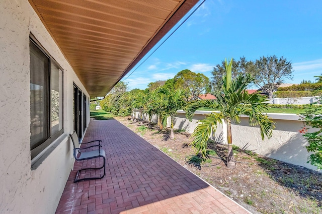 10298 Greentrail Dr N, Boynton Beach, FL 33436 - fenced backyard with a patio area