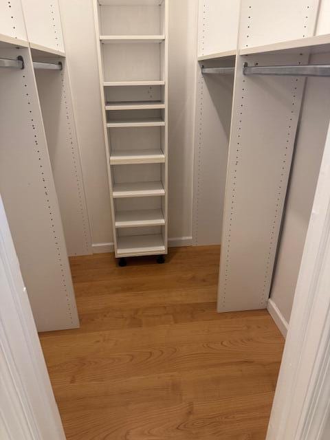 spacious closet featuring light wood-type flooring