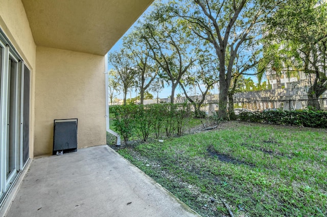 view of yard featuring a patio area and fence