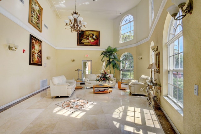 living area with a chandelier, a wealth of natural light, and baseboards