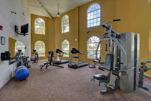 gym featuring baseboards