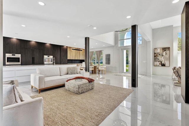 living room with a high ceiling