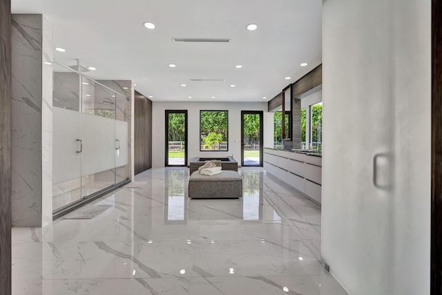 interior space with vanity and walk in shower