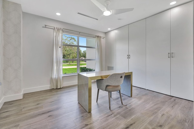 office space with ceiling fan and light hardwood / wood-style floors