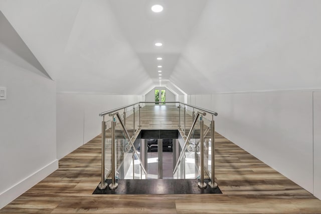 interior space with lofted ceiling and hardwood / wood-style floors