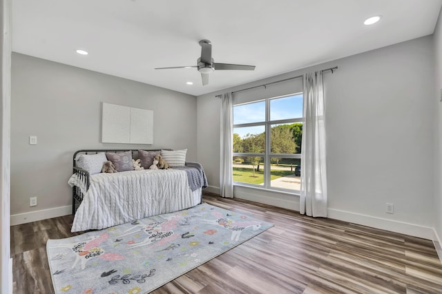 bedroom featuring wood-type flooring and ceiling fan