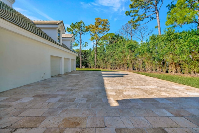 view of patio with a garage