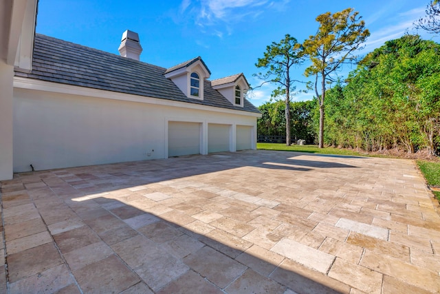 view of patio featuring a garage