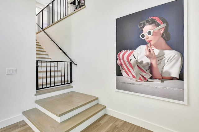 stairs with wood-type flooring