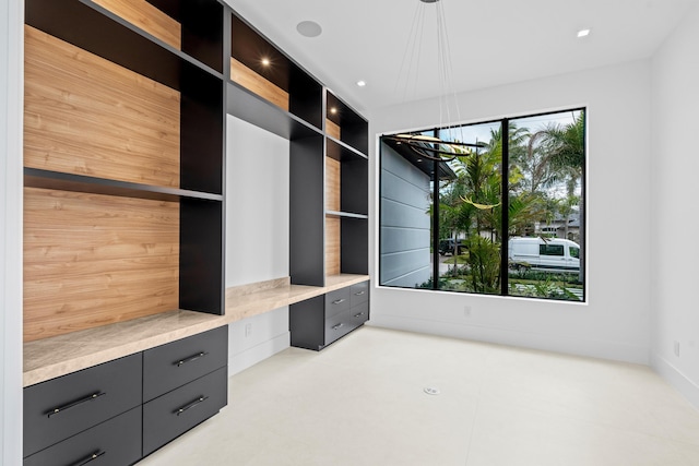 walk in closet featuring built in desk