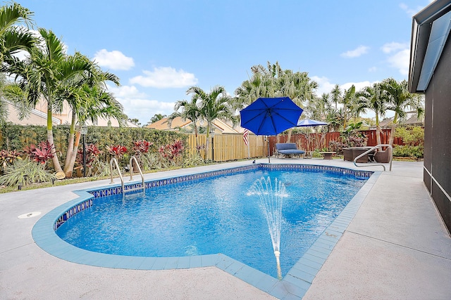 view of pool with a patio and pool water feature