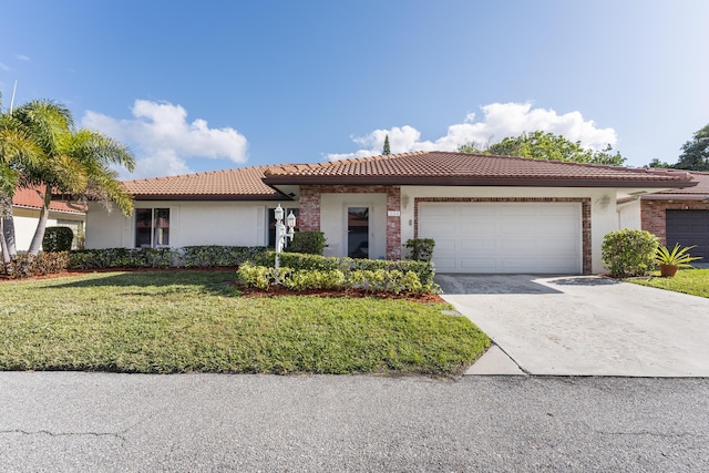 view of front of house with a garage and a front yard