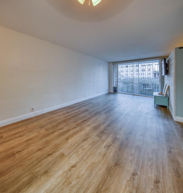 unfurnished room with light hardwood / wood-style floors