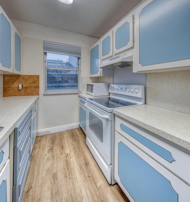 kitchen with a textured ceiling, light hardwood / wood-style flooring, white appliances, decorative backsplash, and white cabinets