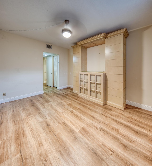 unfurnished room with light hardwood / wood-style flooring