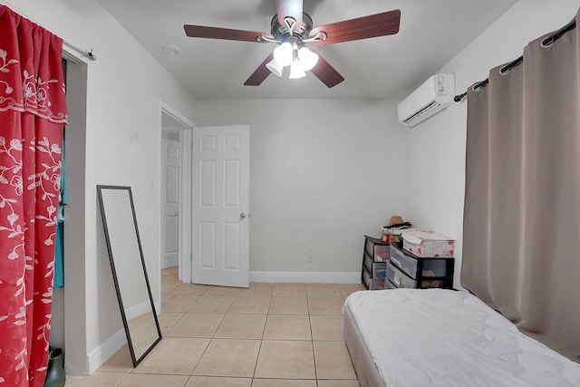 tiled bedroom featuring a wall mounted air conditioner and ceiling fan