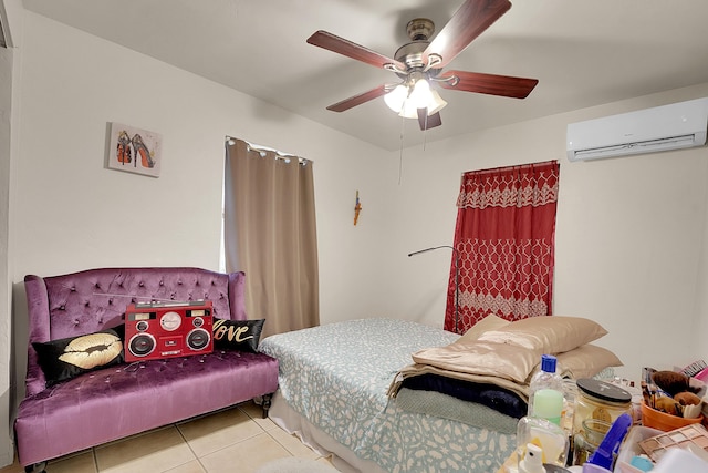 tiled bedroom with a wall unit AC and ceiling fan