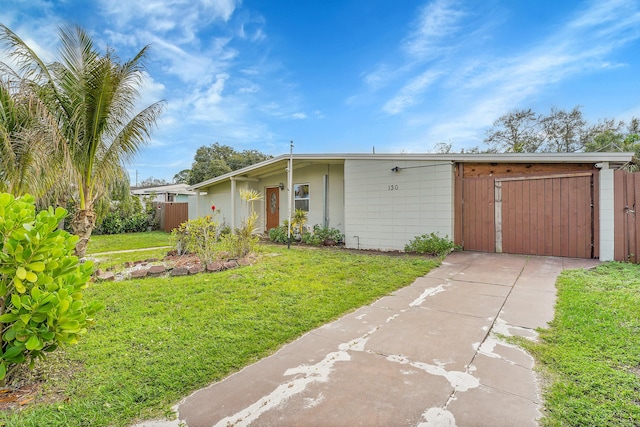 ranch-style house with a front lawn