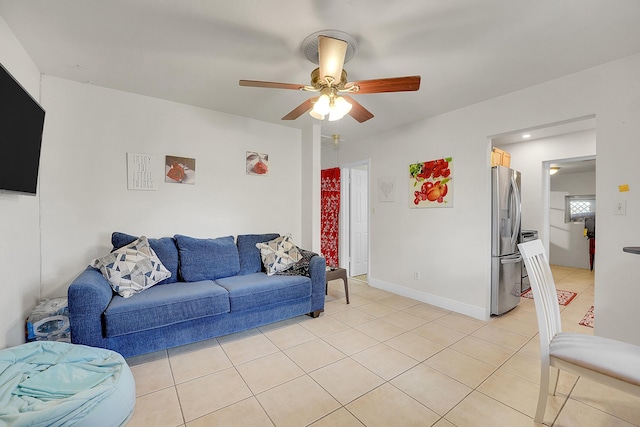 tiled living room with ceiling fan