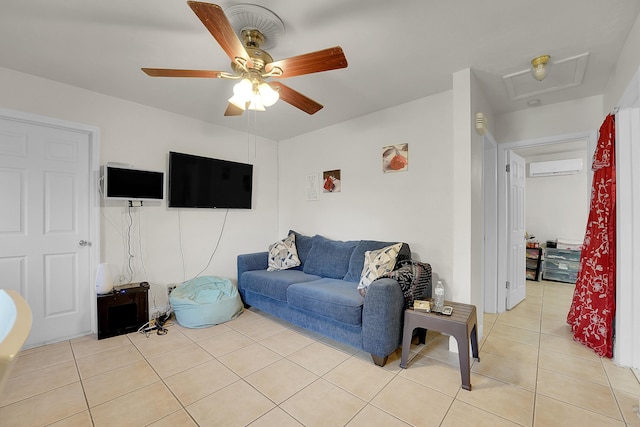 living room featuring ceiling fan, light tile patterned floors, and a wall unit AC