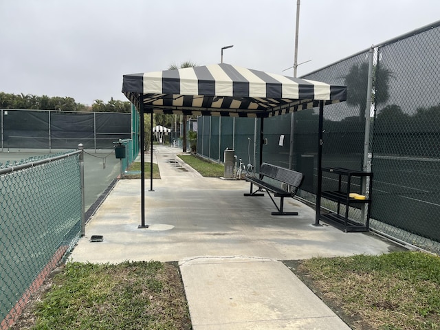 surrounding community featuring tennis court