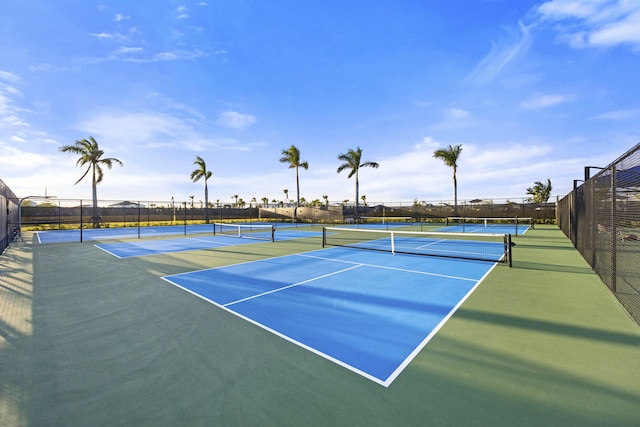 view of tennis court with fence