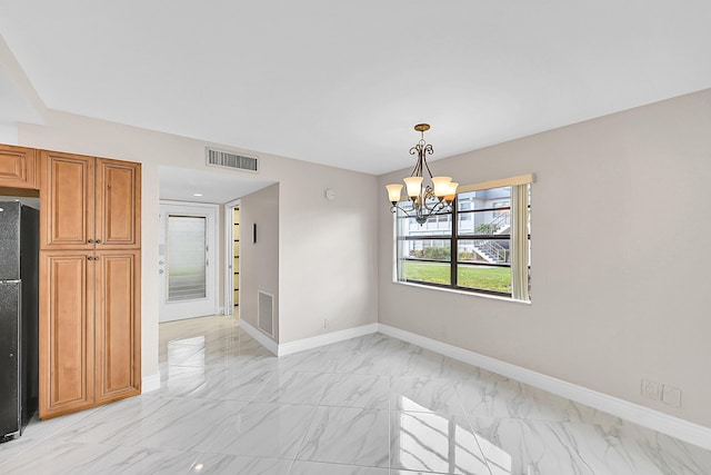 unfurnished dining area featuring a chandelier, marble finish floor, visible vents, and baseboards