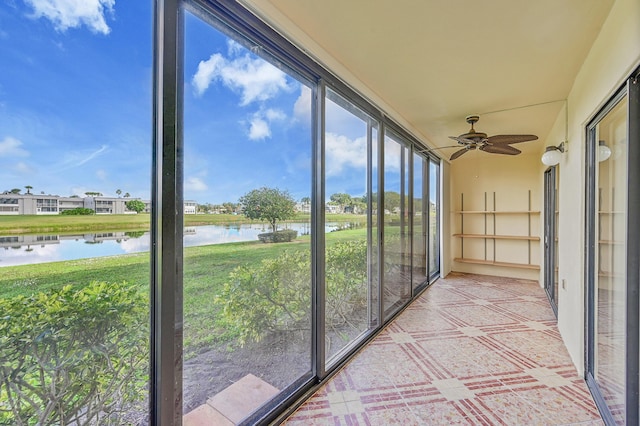 unfurnished sunroom with a water view