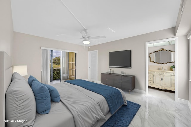 bedroom featuring baseboards, a ceiling fan, ensuite bathroom, marble finish floor, and a sink