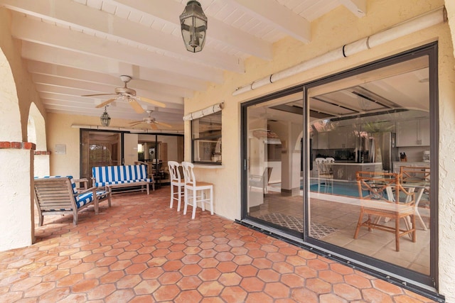 view of patio with ceiling fan and an outdoor living space