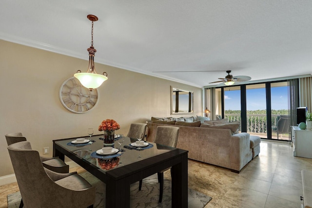 dining area featuring floor to ceiling windows and crown molding