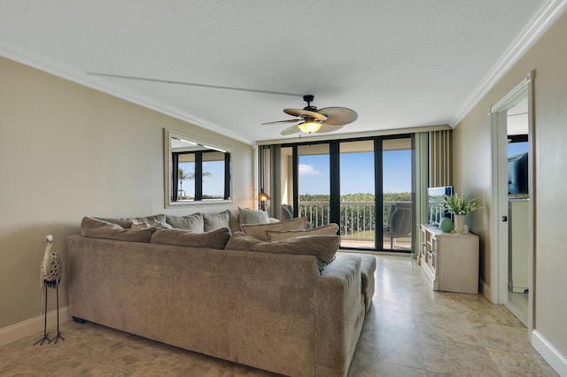 living room featuring a wall of windows, baseboards, ornamental molding, and a ceiling fan