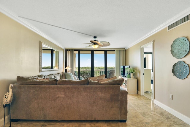 living room featuring crown molding and ceiling fan