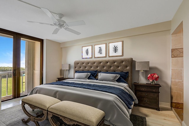 bedroom with floor to ceiling windows, light wood-style flooring, a ceiling fan, and baseboards