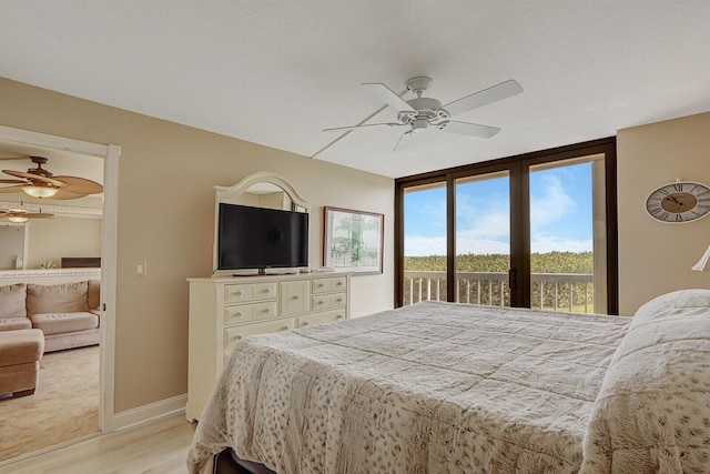 bedroom with baseboards, light wood finished floors, ceiling fan, and access to outside