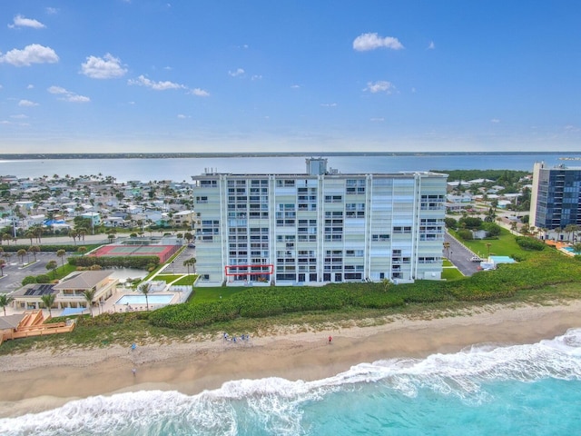 bird's eye view featuring a view of the beach and a water view