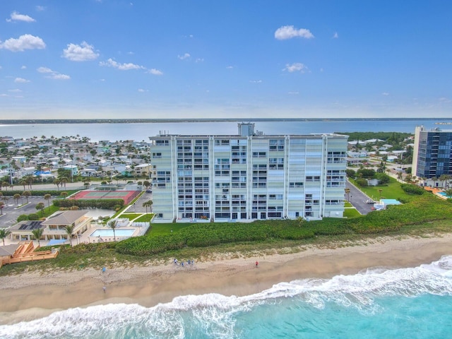 birds eye view of property featuring a water view and a view of the beach