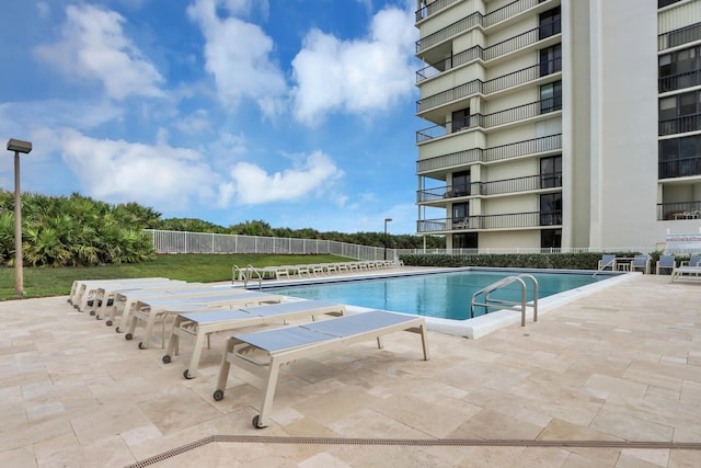 view of swimming pool with a patio area