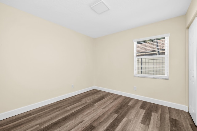 spare room featuring wood-type flooring