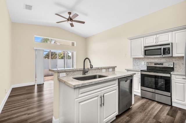 kitchen featuring sink, stainless steel appliances, and white cabinets