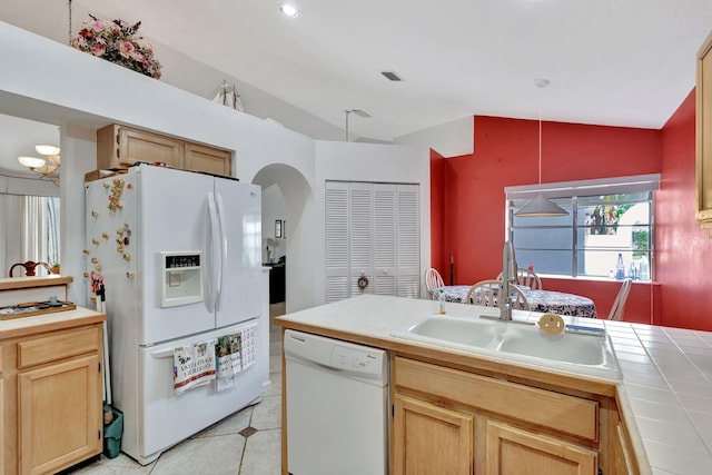 9158 Heathridge Dr, West Palm Beach, FL 33411 - kitchen featuring lofted ceiling, sink, white appliances, pendant lighting, and tile counters