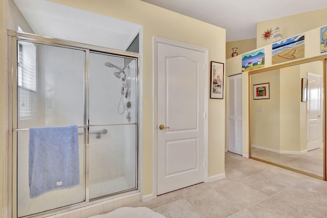 9158 Heathridge Dr, West Palm Beach, FL 33411 - bathroom featuring tile patterned flooring and a shower with door