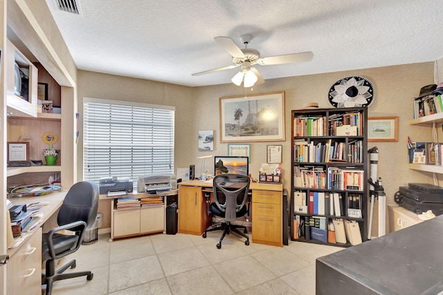9158 Heathridge Dr, West Palm Beach, FL 33411 - home office featuring light tile patterned floors, a textured ceiling, and ceiling fan