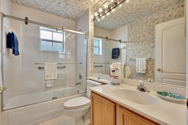 9158 Heathridge Dr, West Palm Beach, FL 33411 - full bathroom with vanity, combined bath / shower with glass door, tile patterned floors, and toilet