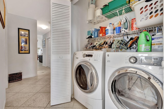 9158 Heathridge Dr, West Palm Beach, FL 33411 - laundry room with light tile patterned flooring and washer and dryer