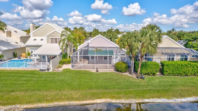 9158 Heathridge Dr, West Palm Beach, FL 33411 - rear view of property featuring a patio area, a lawn, a water view, and glass enclosure
